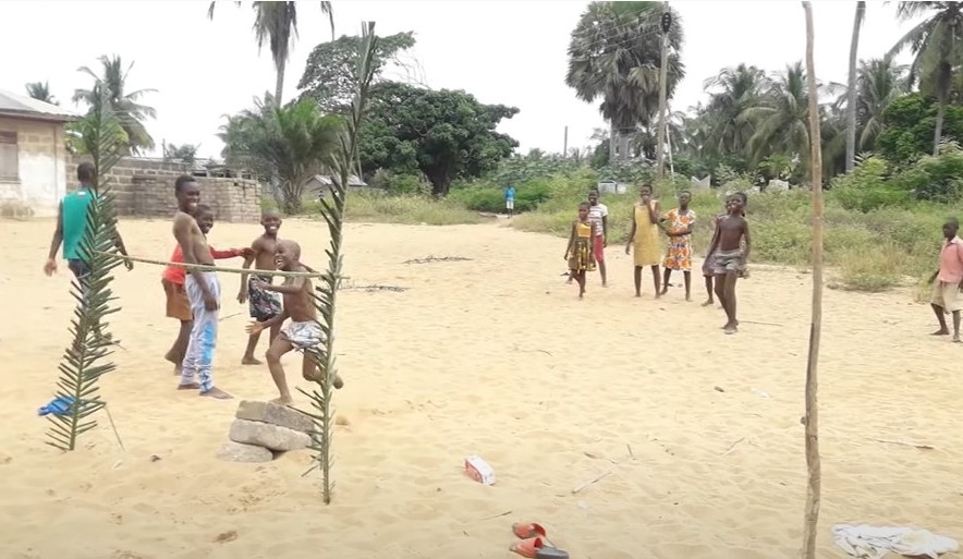 Children taking a high jump